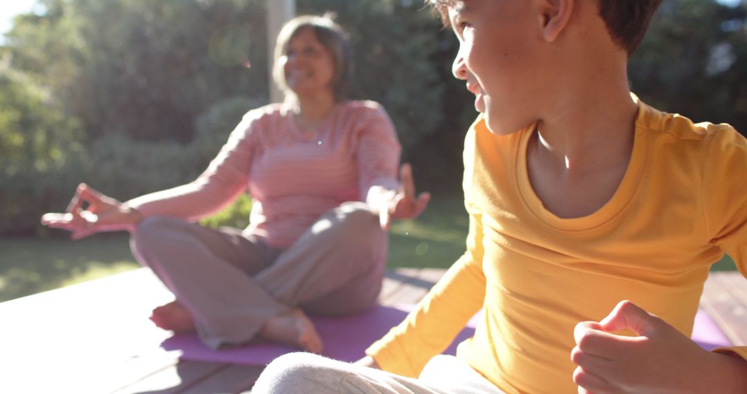 Mother and Son Practicing Yoga Outdoors in Morning Sunlight - Free Images, Stock Photos and Pictures on Pikwizard.com