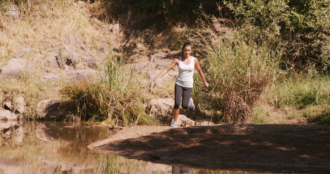 Woman jogging in the countryside on a sunny day - Free Images, Stock Photos and Pictures on Pikwizard.com