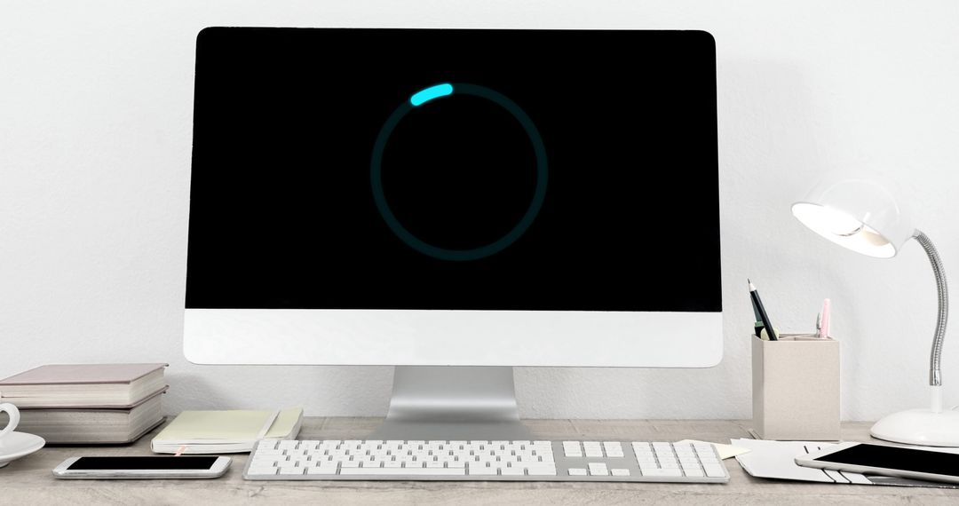 Minimalist Workspace with Loading Screen Illumination - Free Images, Stock Photos and Pictures on Pikwizard.com