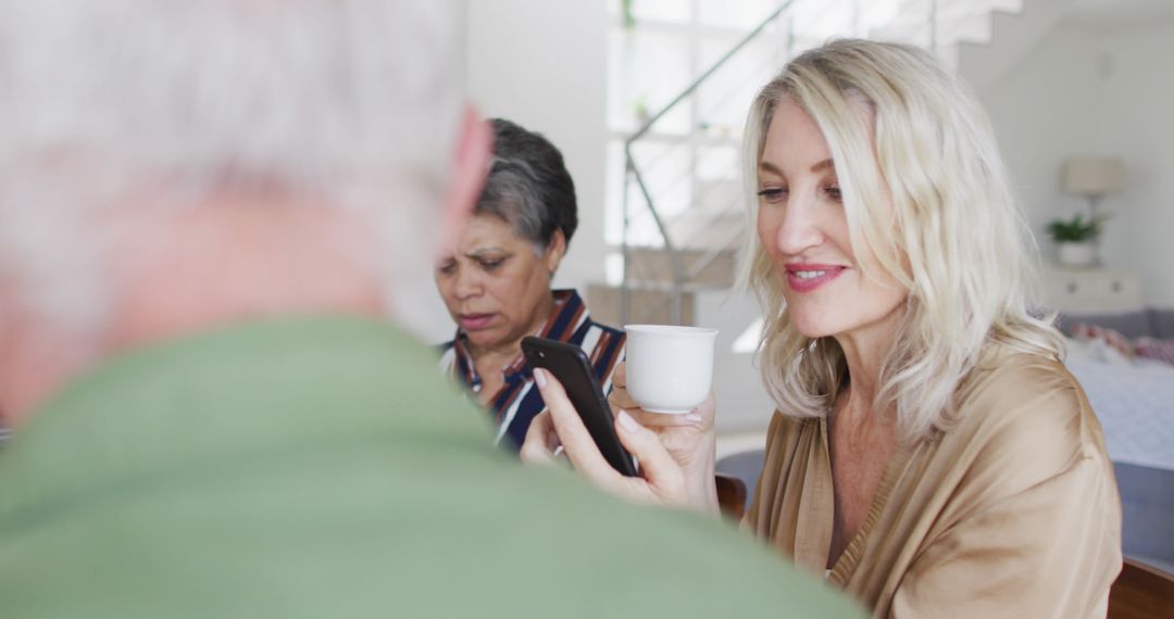 Senior Friends Using Smartphones at Home Capturing Modern Tech Lifestyle