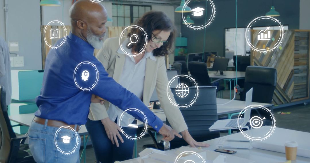 Business Colleagues Engaging with Growth Icon Overlays on Documents