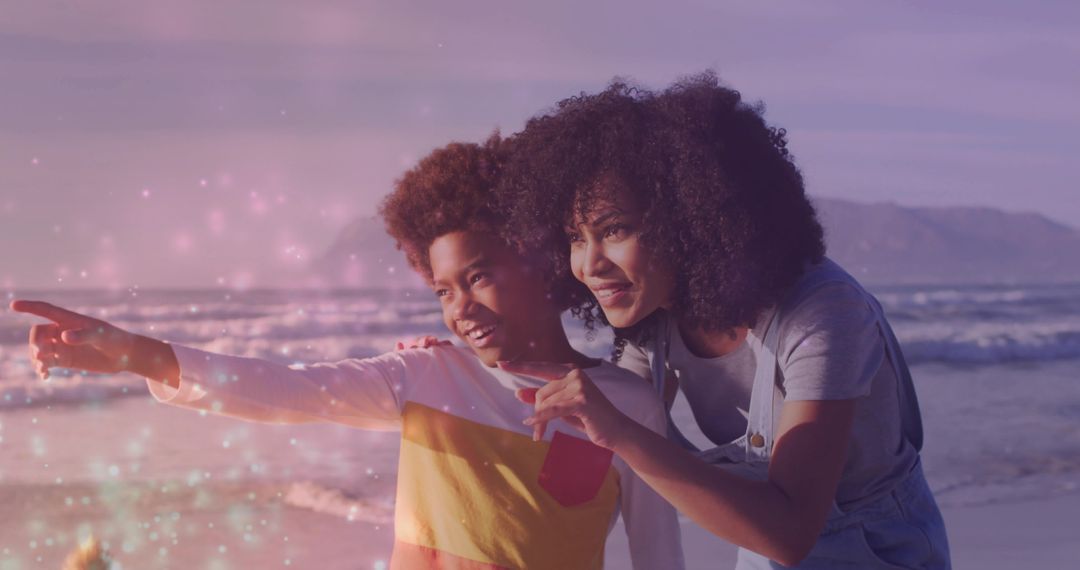 Mother and Son Exploring Sunset Beach with Exuberance