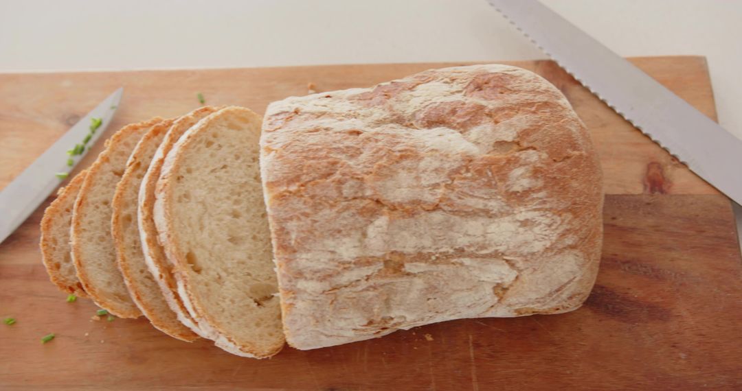 Crusty Artisan Bread Loaf on Wooden Cutting Board
