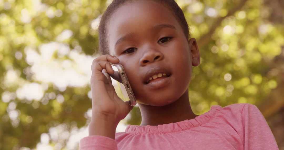 Cute Girl in Park Making Phone Call with Mobile Phone