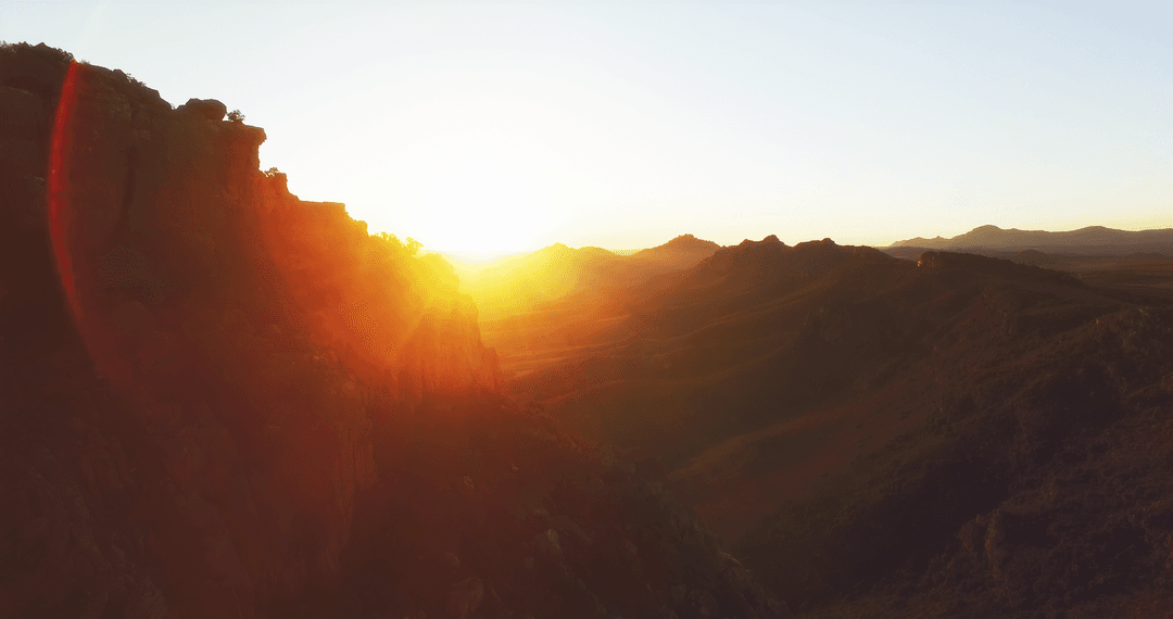 Transparent Sunlit Hillside Cliffs at Sundown