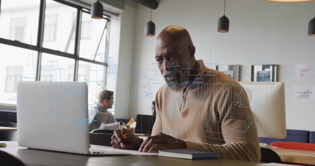 Professional Man Using Laptop in Modern Shared Workspace