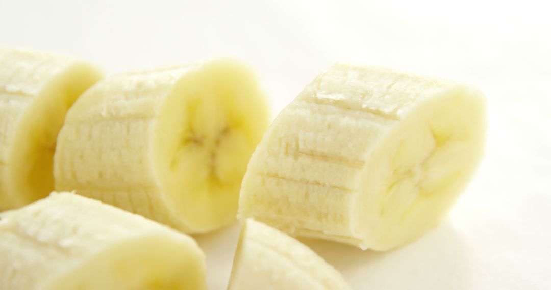 Close-up of Freshly Sliced Bananas on White Background - Free Images, Stock Photos and Pictures on Pikwizard.com