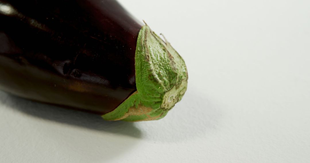 Close-up of Fresh Raw Eggplant on White Background - Free Images, Stock Photos and Pictures on Pikwizard.com