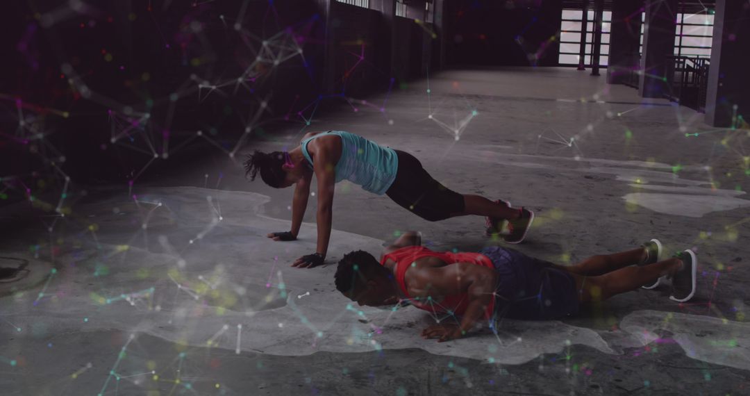 Dynamic Duo Exercising Burpees with Futuristic Digital Network Overlay
