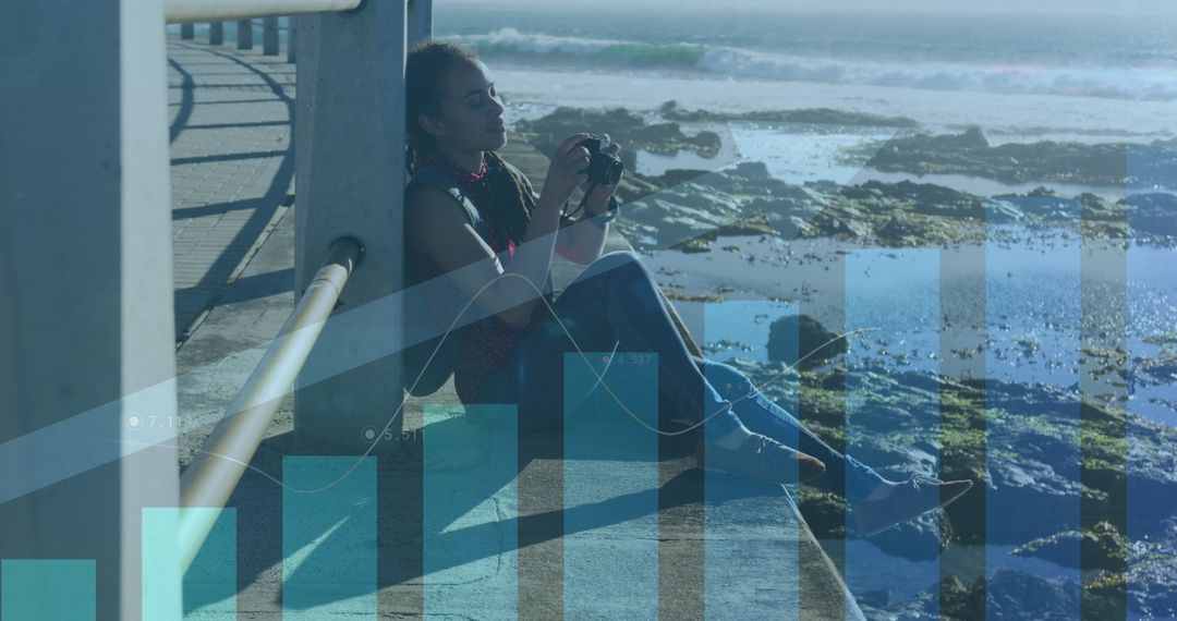 Woman Photographing by Ocean Promenade with Overlaid Graphs