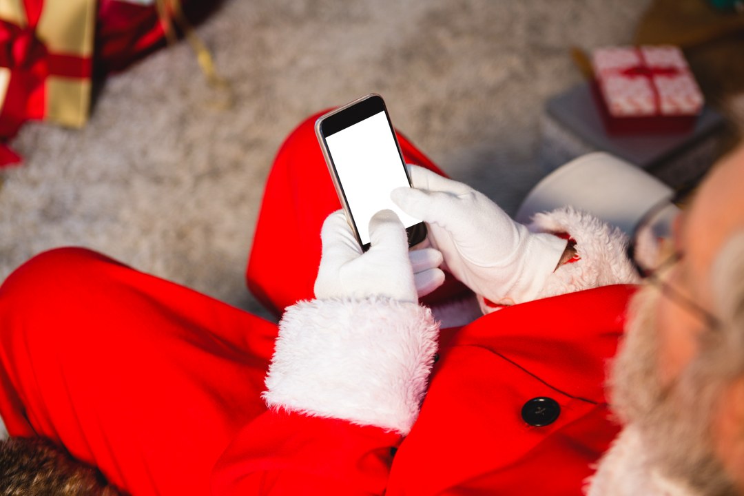 Santa Claus Using Transparent Mobile Phone for Video Call at Home - Download Free Stock Images Pikwizard.com