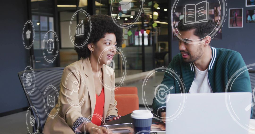 Colleagues Analyzing Data with Digital Icons Overlay