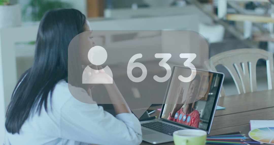 Woman Engaging in Video Call with Social Media Metrics