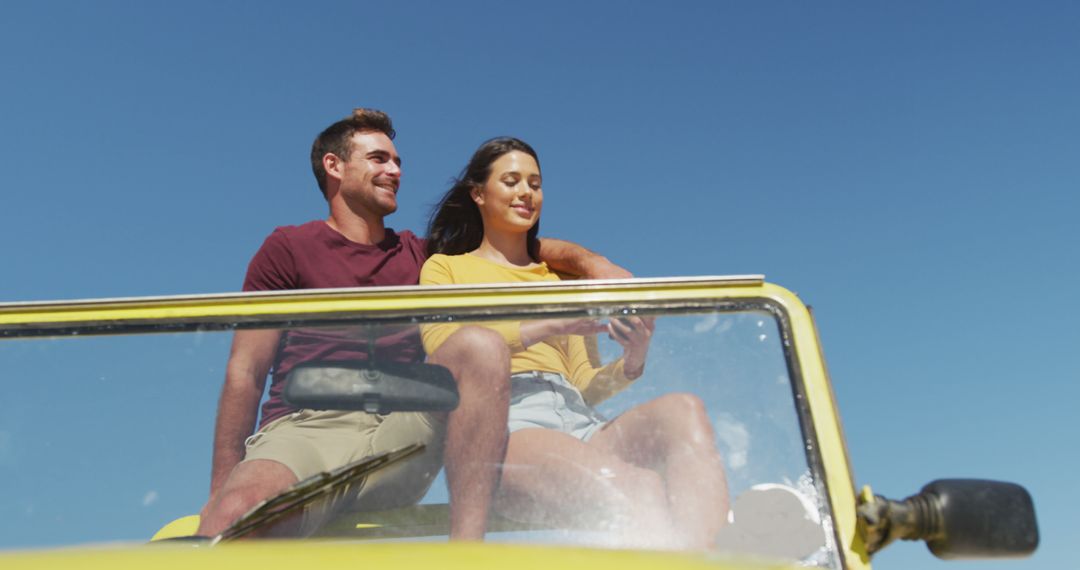 Couple Enjoying Road Trip in Open-Top Vehicle on Sunny Day - Free Images, Stock Photos and Pictures on Pikwizard.com