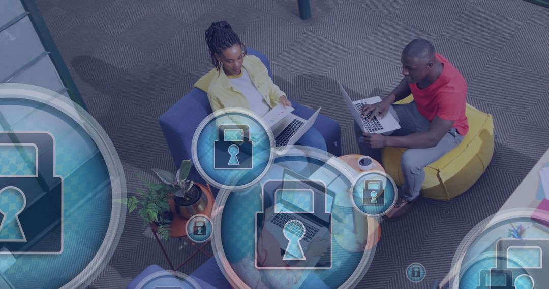 Coworkers Collaborating with Digital Security Icons Overlay