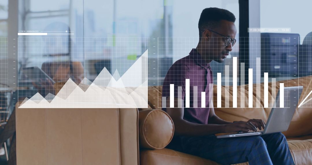 Modern Data Analyst Working Remotely Analyzing Graphs on Laptop