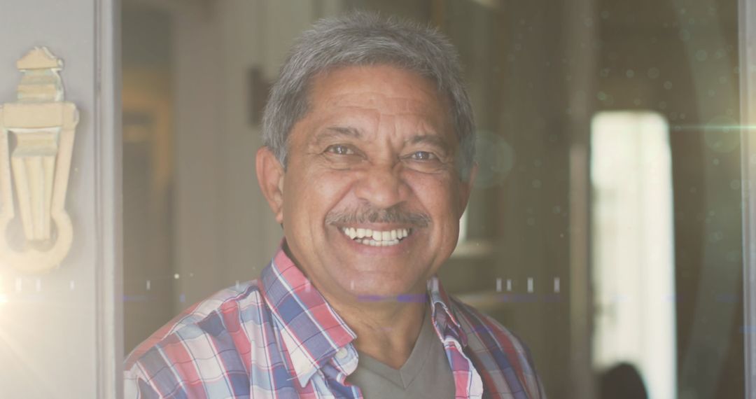 Senior Man Smiling in Warm Light for Retirement Concepts