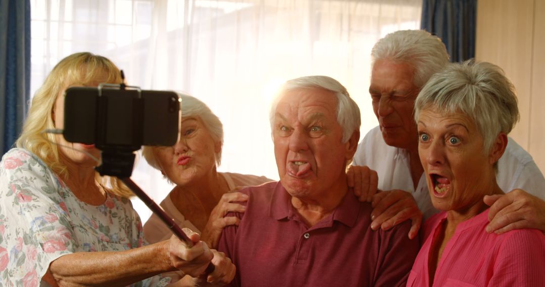 Seniors Having Fun Taking Silly Selfie Together - Free Images, Stock Photos and Pictures on Pikwizard.com