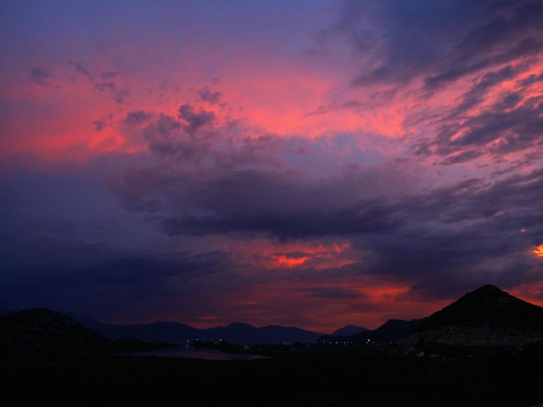 Dramatic Sunset Over Mountainous Landscape with Colorful Sky - Free Images, Stock Photos and Pictures on Pikwizard.com