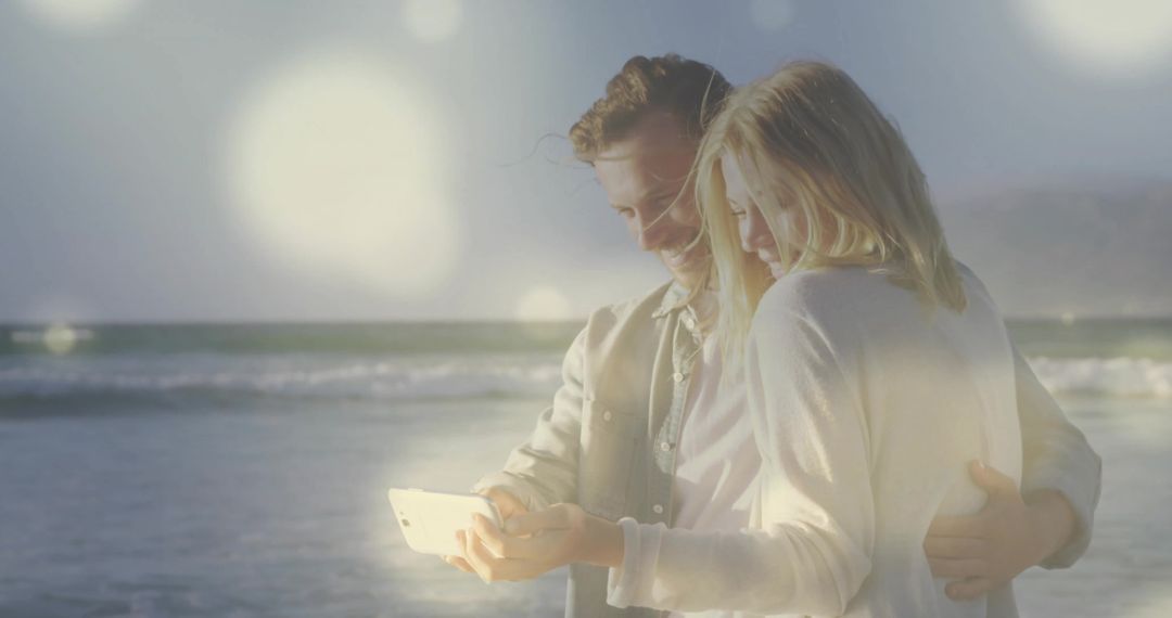 Hugging Couple Taking Selfie on Tranquil Beach