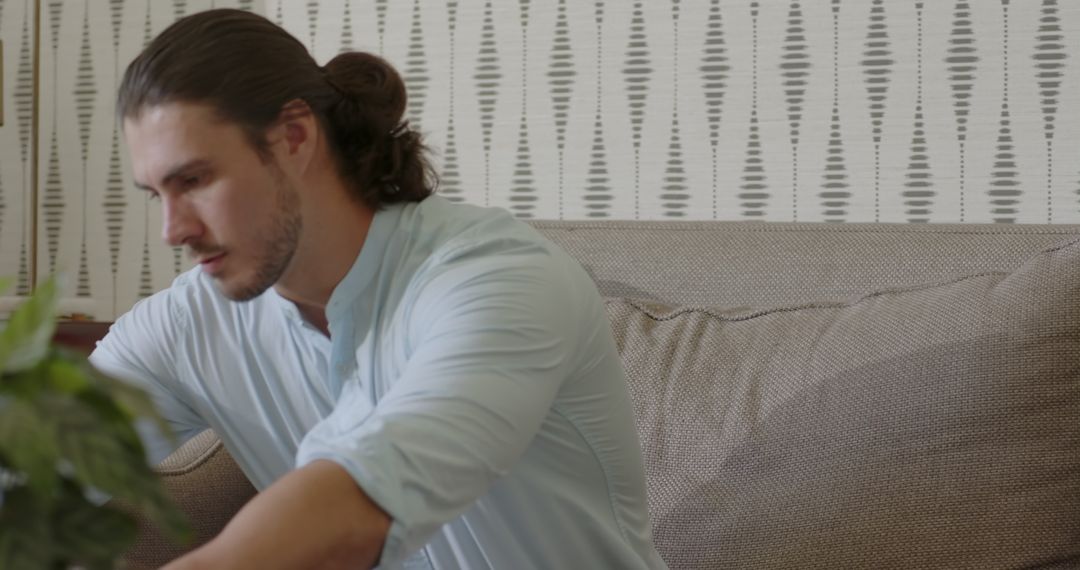 Man Deep in Thought Using Laptop at Home Office