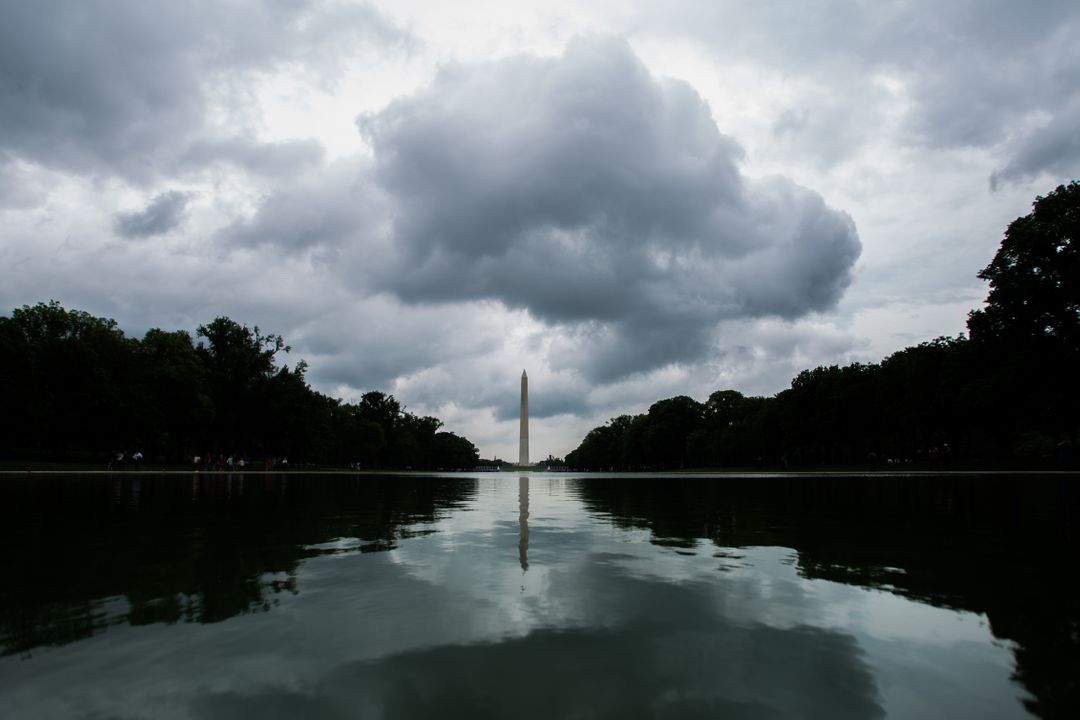 Cloudy Sky over Washington Monument Reflecting in Pool - Free Images, Stock Photos and Pictures on Pikwizard.com