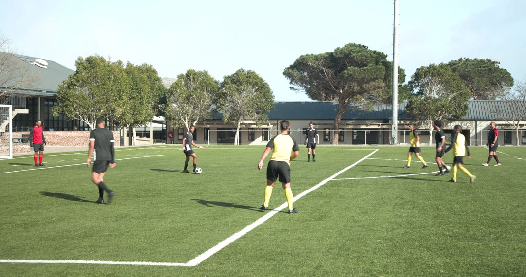 Youth Soccer Team Practicing On Field Under Clear Sky