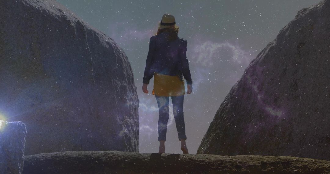 Adventurous Explorer Stands Under Starry Cosmos