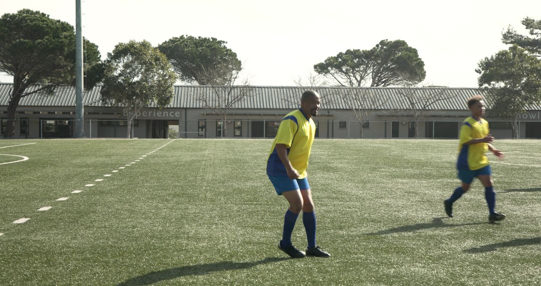 Youth Soccer Players Focused on Teamwork on Field
