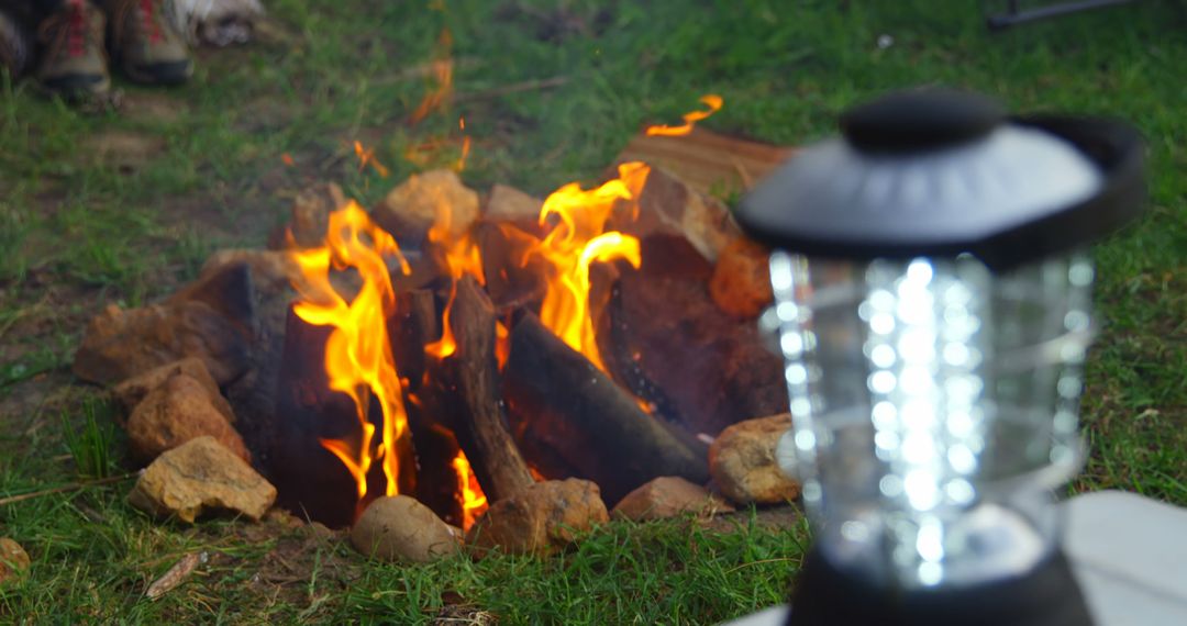 Warm Campfire and Lantern in Outdoor Setting - Free Images, Stock Photos and Pictures on Pikwizard.com