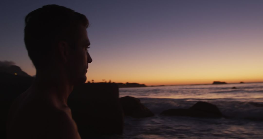 Man Watching Serene Beach Sunset - Free Images, Stock Photos and Pictures on Pikwizard.com