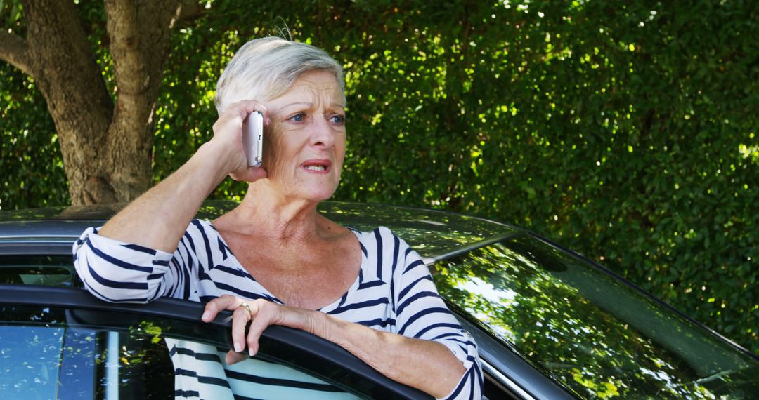 Worried Senior Woman Talking on Phone Next to Car - Free Images, Stock Photos and Pictures on Pikwizard.com