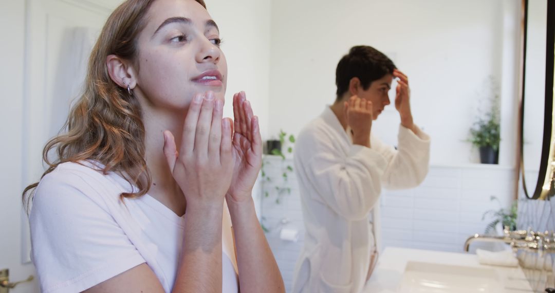 Couple Practicing Skincare Routine in Bathroom - Free Images, Stock Photos and Pictures on Pikwizard.com