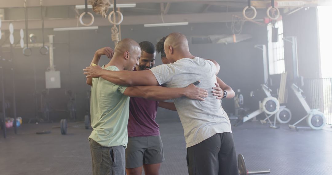 Happy Young African American Men with Arms Around Each Other in Gym Encouraging - Free Images, Stock Photos and Pictures on Pikwizard.com