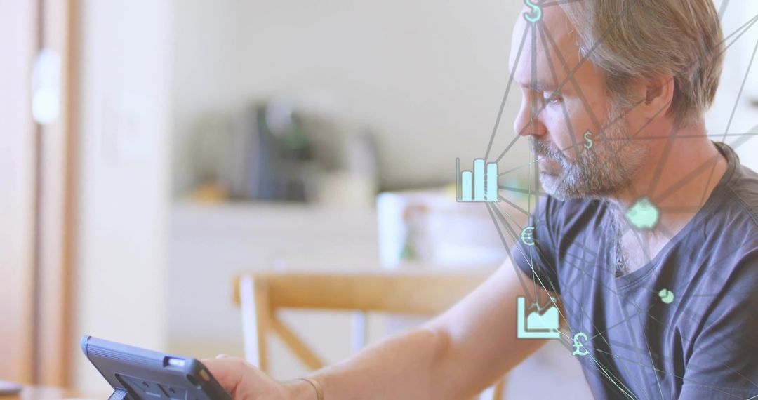 Man Analyzing Data on Tablet with Tech Overlay at Home Workspace