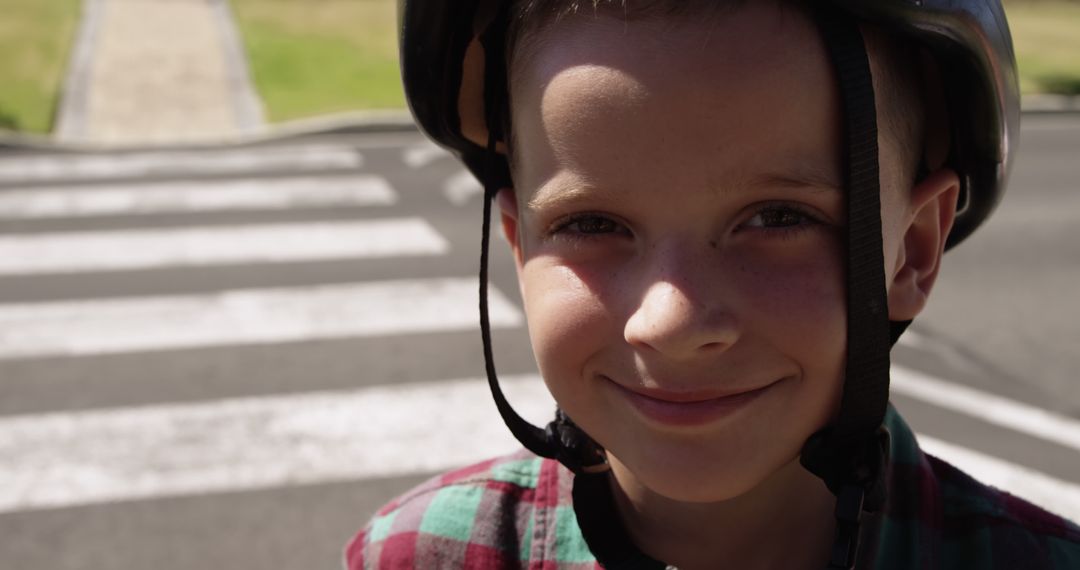 Smiling Child Wearing Helmet on Crosswalk - Free Images, Stock Photos and Pictures on Pikwizard.com