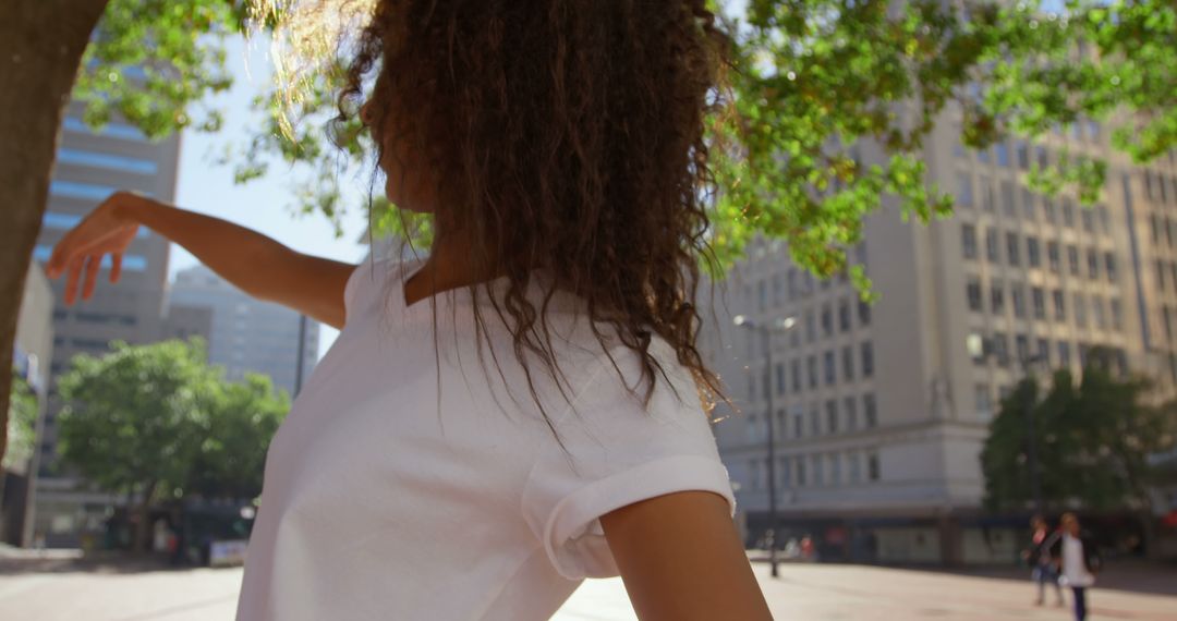 Woman Dancing Elegantly Outside in Urban City - Free Images, Stock Photos and Pictures on Pikwizard.com