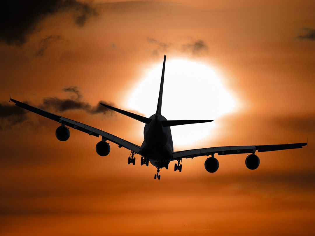 Shadow Image of a Plane Flying during Sunset - Free Images, Stock Photos and Pictures on Pikwizard.com