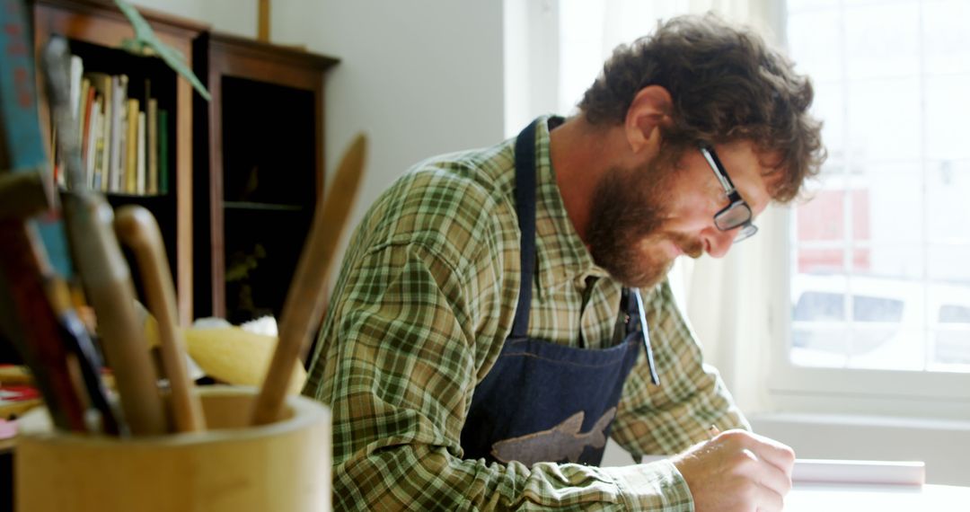 Bearded Artist Working on a Drawing in Studio - Free Images, Stock Photos and Pictures on Pikwizard.com