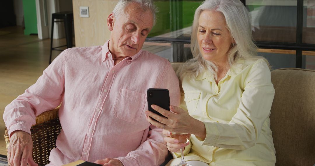 Senior Couple Bonding Over Smartphone Use at Home