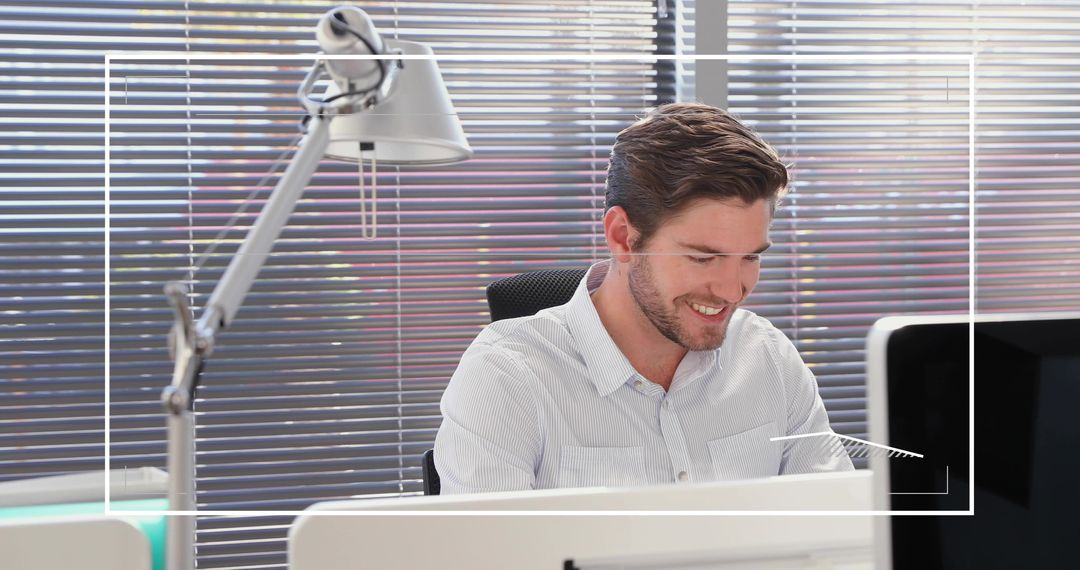 Smiling Professional Man Working in Modern Office Setting