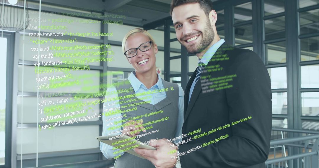 Smiling Business Professionals Analyzing Digital Data Display