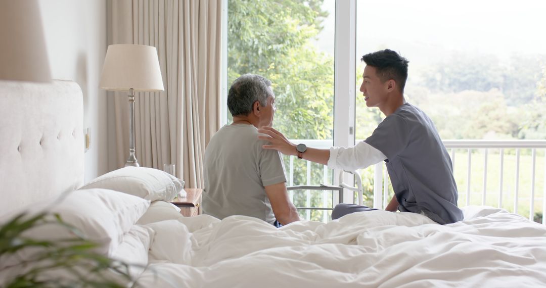 Caregiver Assisting Elderly Man in Bedroom - Free Images, Stock Photos and Pictures on Pikwizard.com