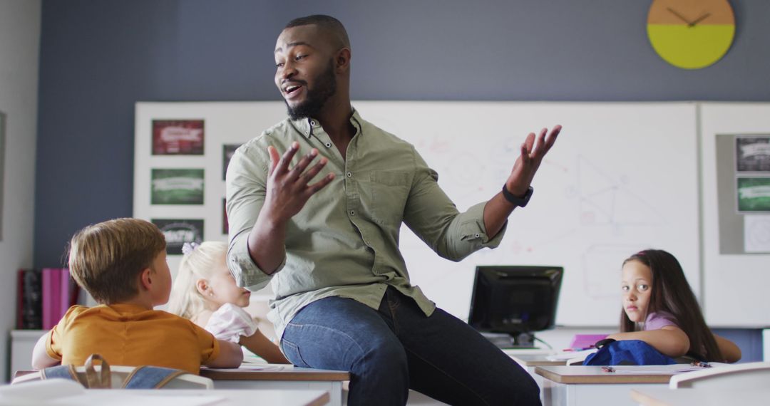 Image of happy african american male teacher during lesson with class of diverse pupils - Free Images, Stock Photos and Pictures on Pikwizard.com