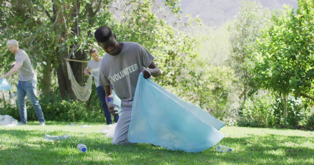 Volunteers Collecting Litter in Park for Environmental Cleanup - Free Images, Stock Photos and Pictures on Pikwizard.com