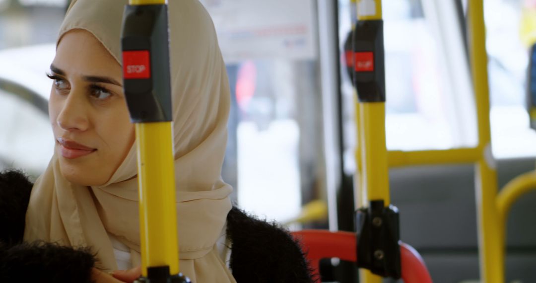 Young Muslim Woman Riding Bus in City - Free Images, Stock Photos and Pictures on Pikwizard.com