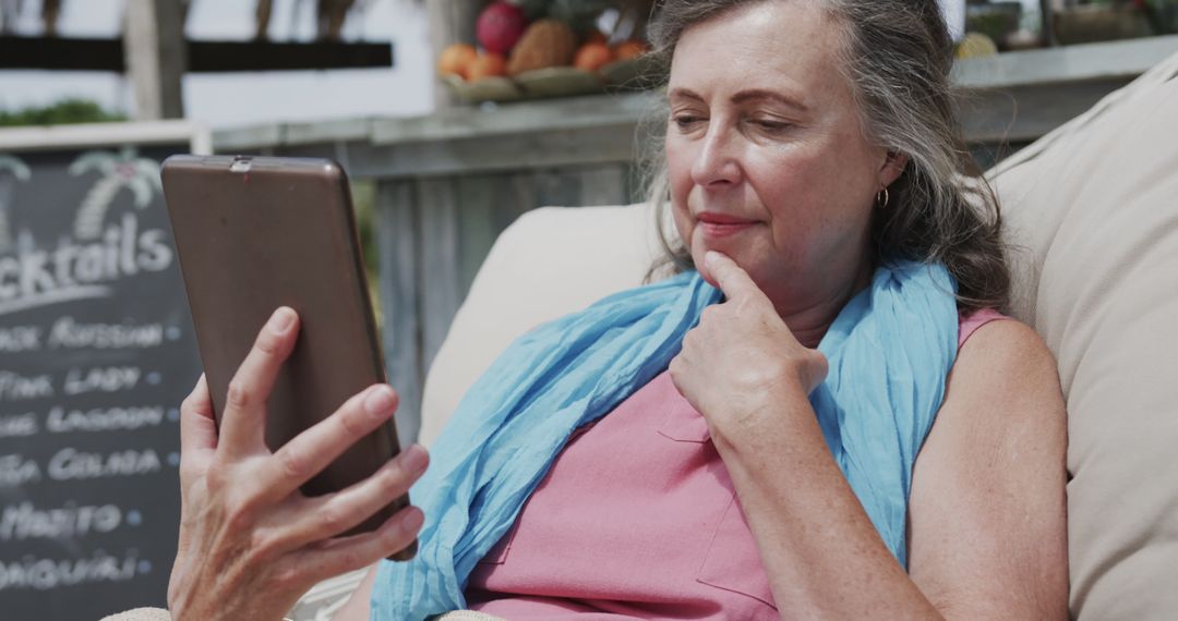 Senior Woman Relaxing Outdoor with Tablet - Free Images, Stock Photos and Pictures on Pikwizard.com