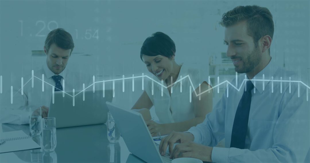 Professional Team Analyzing Data with Laptops in Modern Office