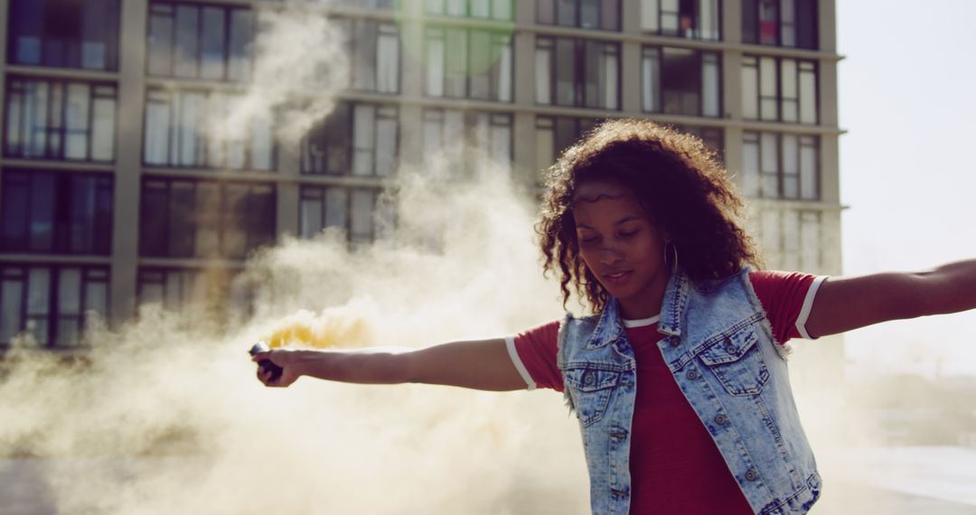 Young Woman Waving Smoke Bomb Outdoors in Urban Setting - Free Images, Stock Photos and Pictures on Pikwizard.com