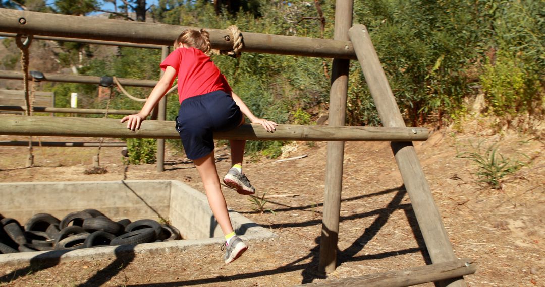 Boy Climbing Wooden Obstacle Course in Outdoor Adventure Park - Free Images, Stock Photos and Pictures on Pikwizard.com